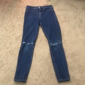 Blue jeans with rips on the knees